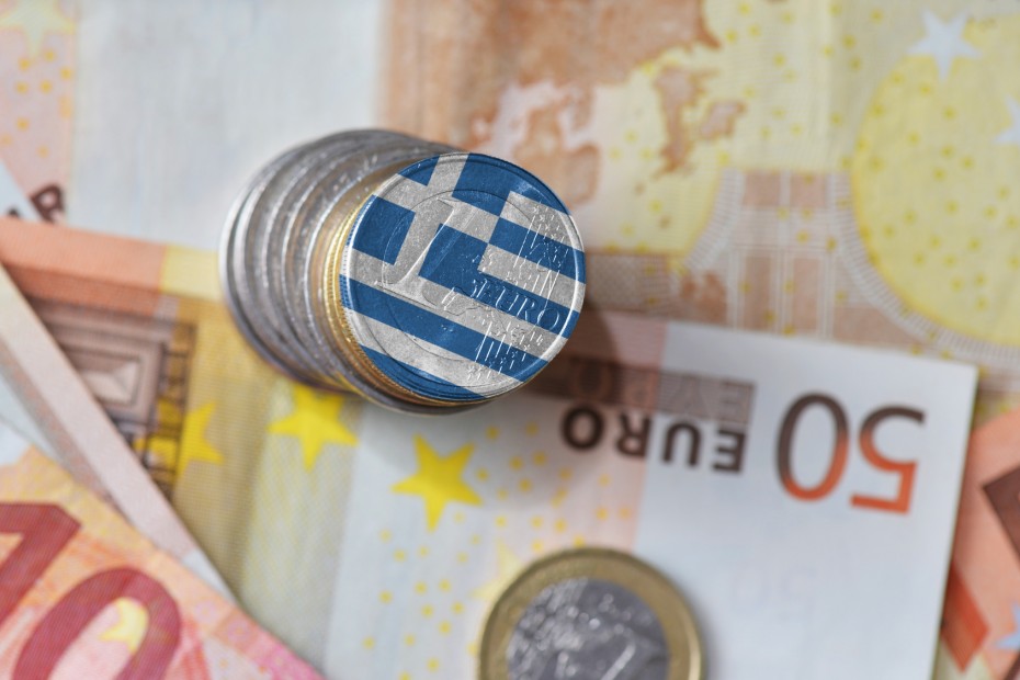 euro coin with national flag of greece on the euro money banknotes background.
