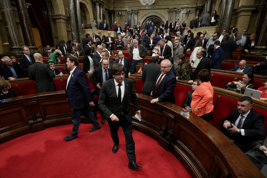 Catalan President Puigdemont leaves the chamber after a session at the Catalan regional Parliament in Barcelona