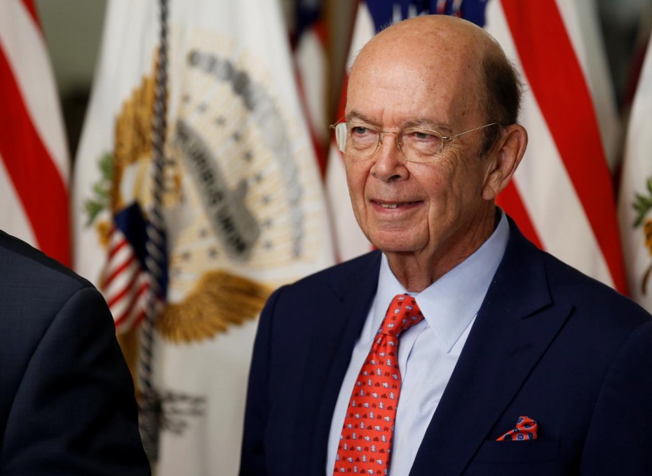 Wilbur Ross stands after being sworn in as Secretary of Commerce in Washington