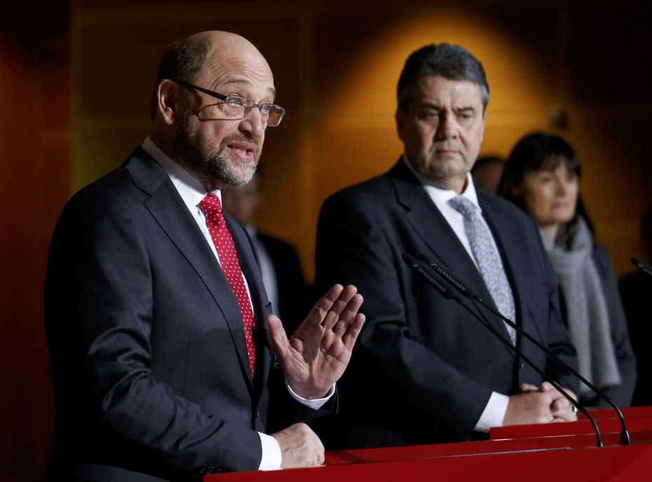 Former president of the European Parliament Schulz speaks next to German Economy Minister and Leader of the SPD party Gabriel during a news conference in Berlin