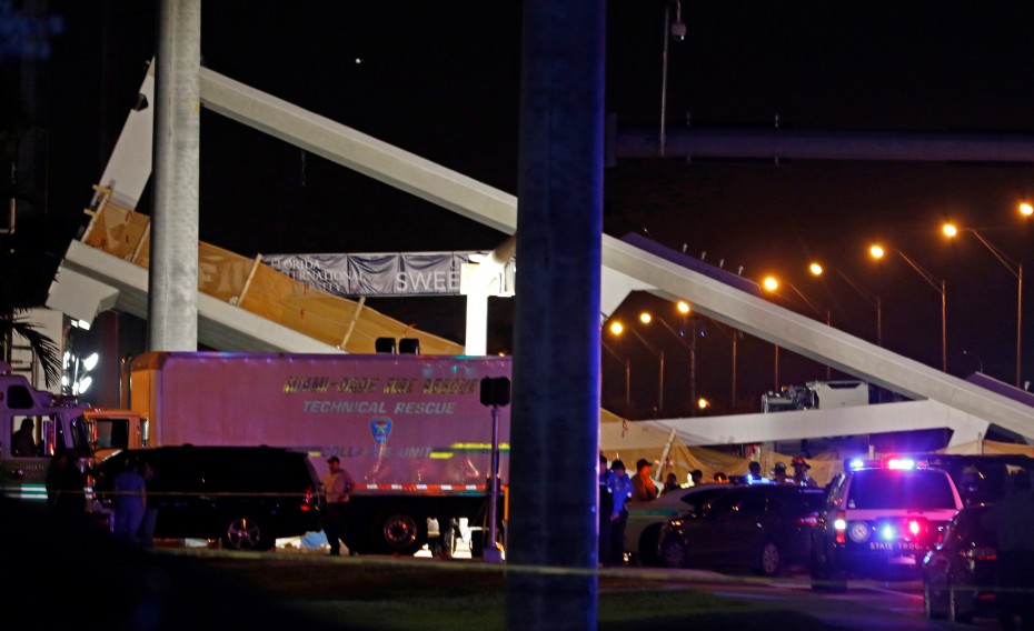 First responders continue on rescue efforts after a pedestrian bridge collapsed at Florida International University in Miami